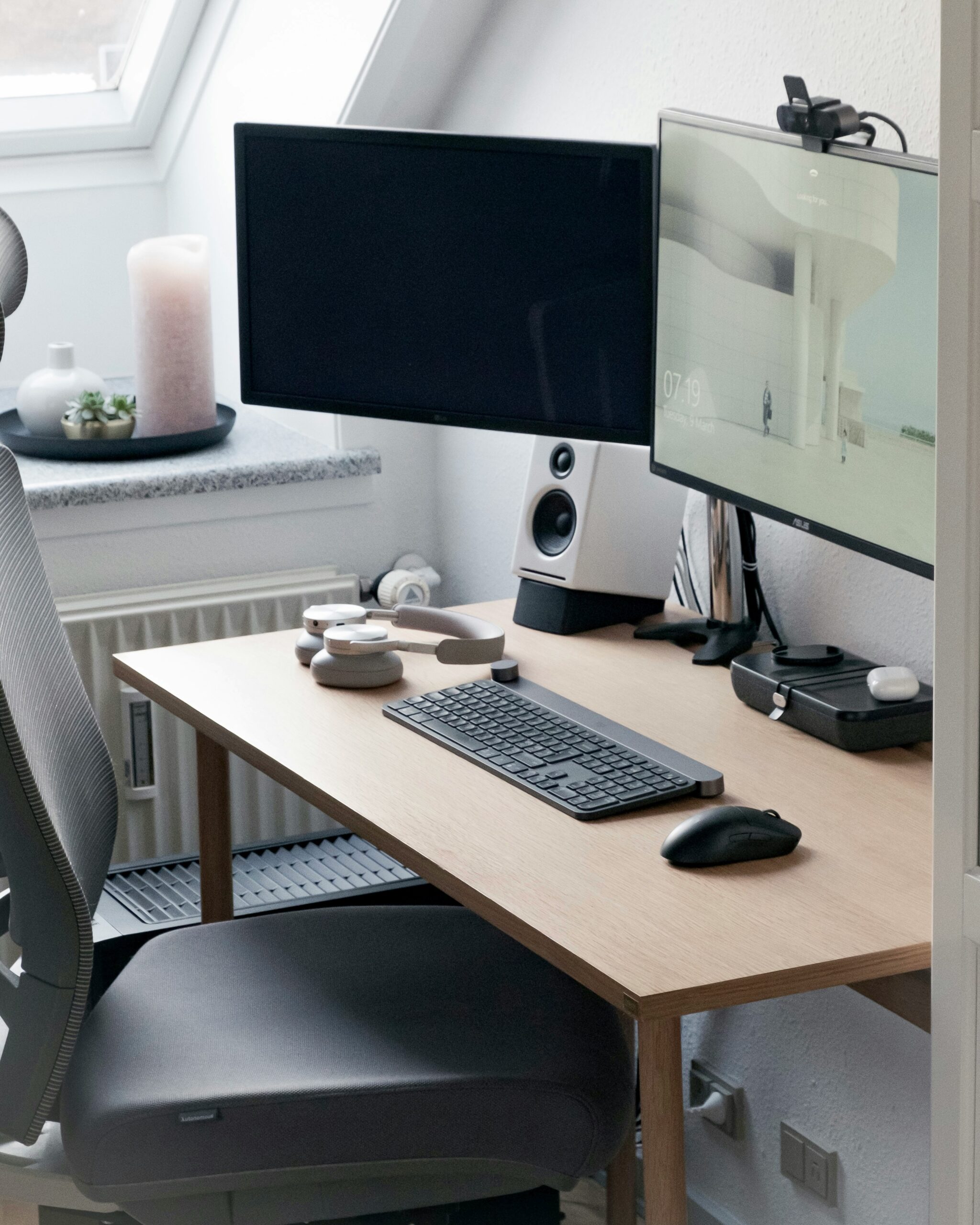 virtual workspace with desk and chair, monitors, next to candles - nemi medical + wellness